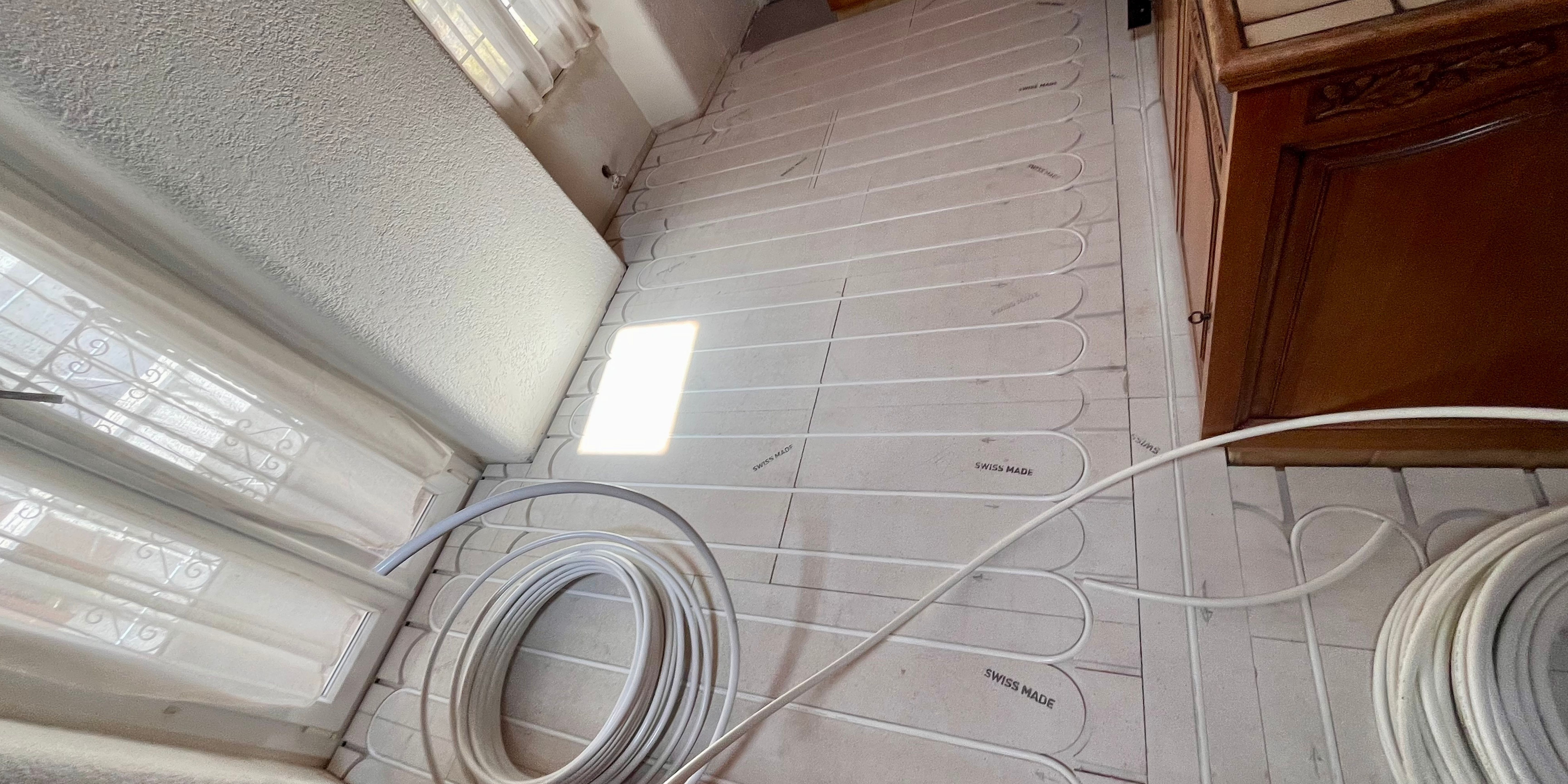 Rénovation sol chauffant à Nendaz avec carrelage grand format